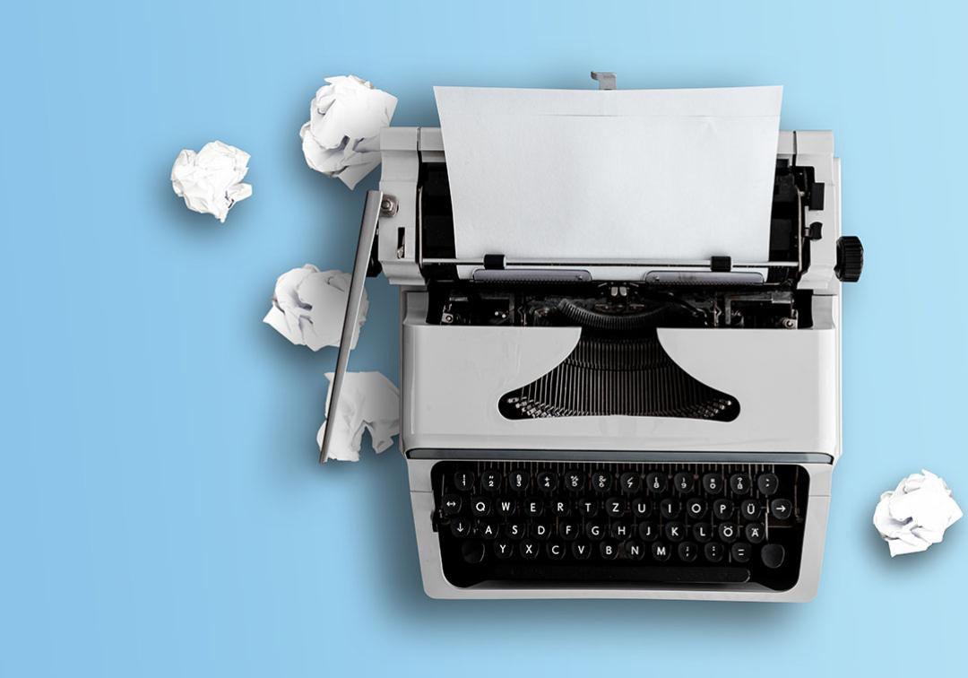 Typewriter on blue background