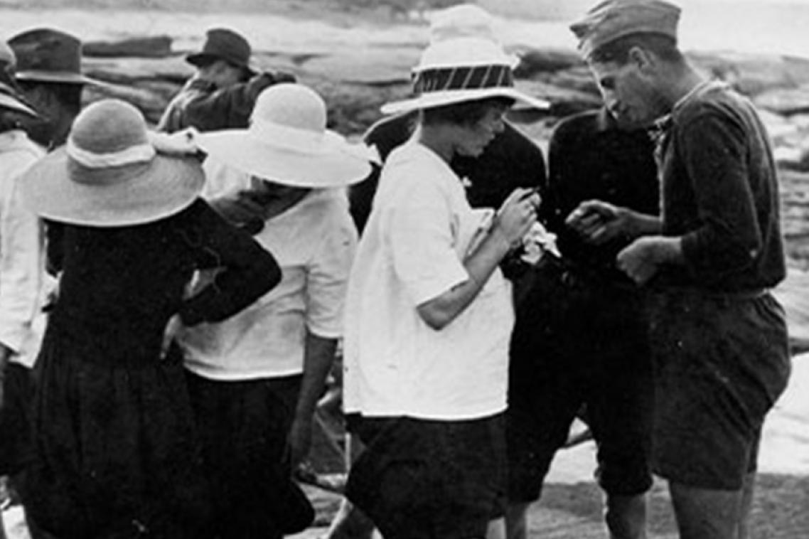 Black and white photos of children enjoying beach.